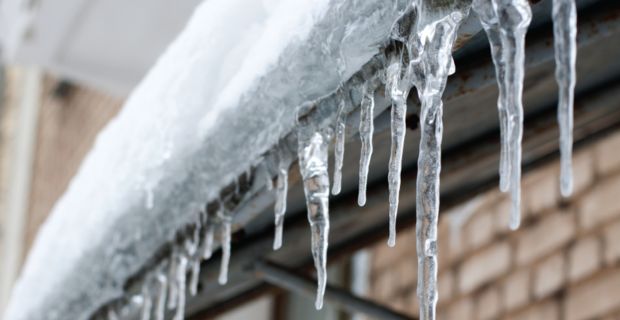 Snow and ice buildup on top of a roof 