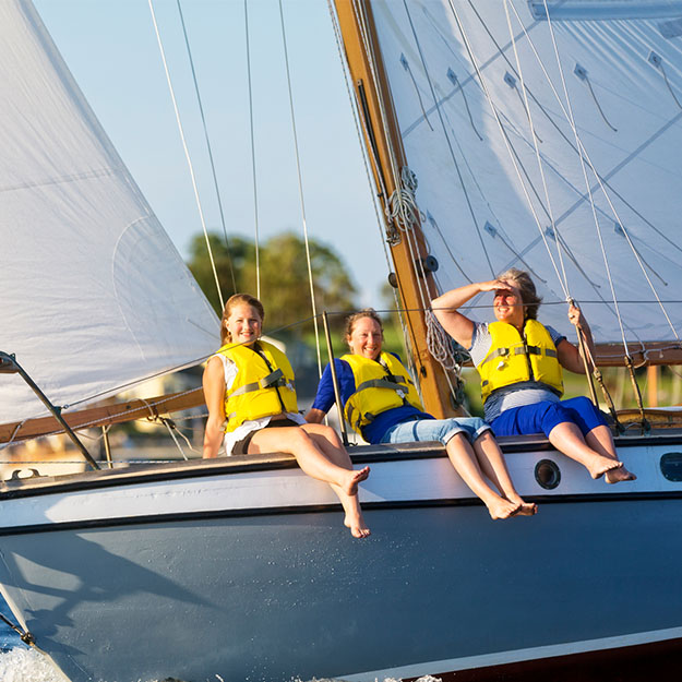 Grandmother, daughter and granddaughter enjoy a day of sailing