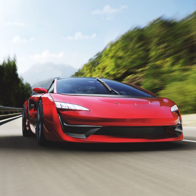 A bright red limited edition sports car driving on a scenic highway.